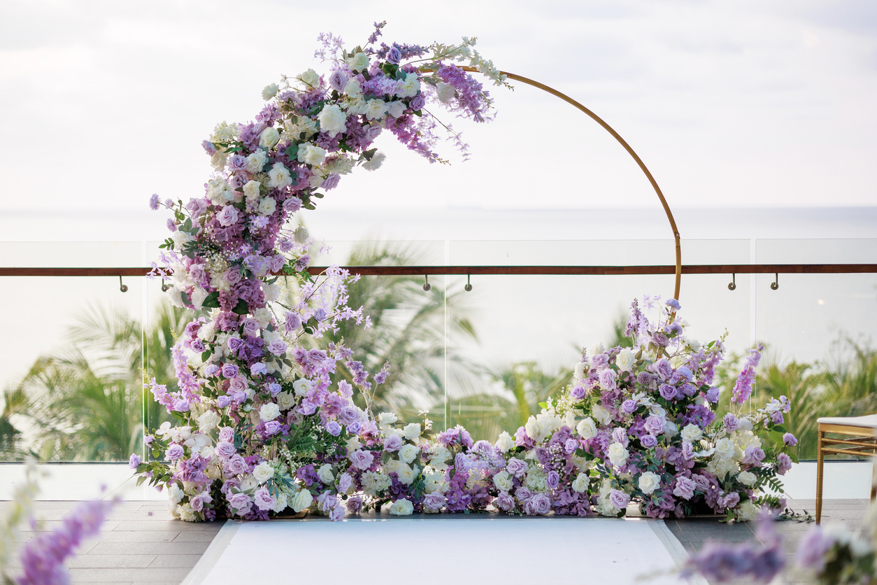 beautiful-wedding-arch-adorned-with-white-and-purple-flowers